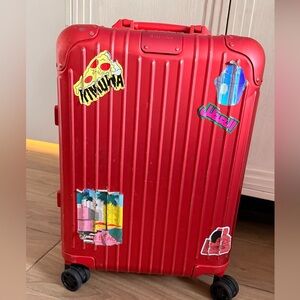RIMOWA Red Salsa Deluxe Multiwheel suitcase with Stickers